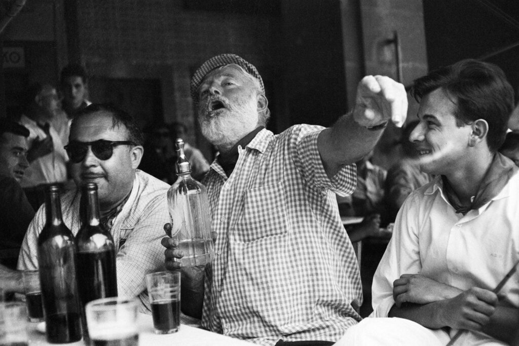 Portrait of Ernest Hemingway drinking in the bar