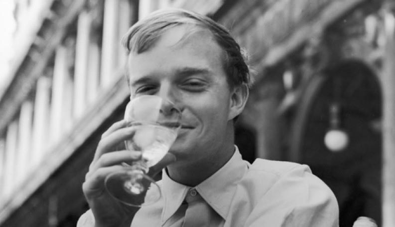Portrait of Truman Capote drinking a cocktail